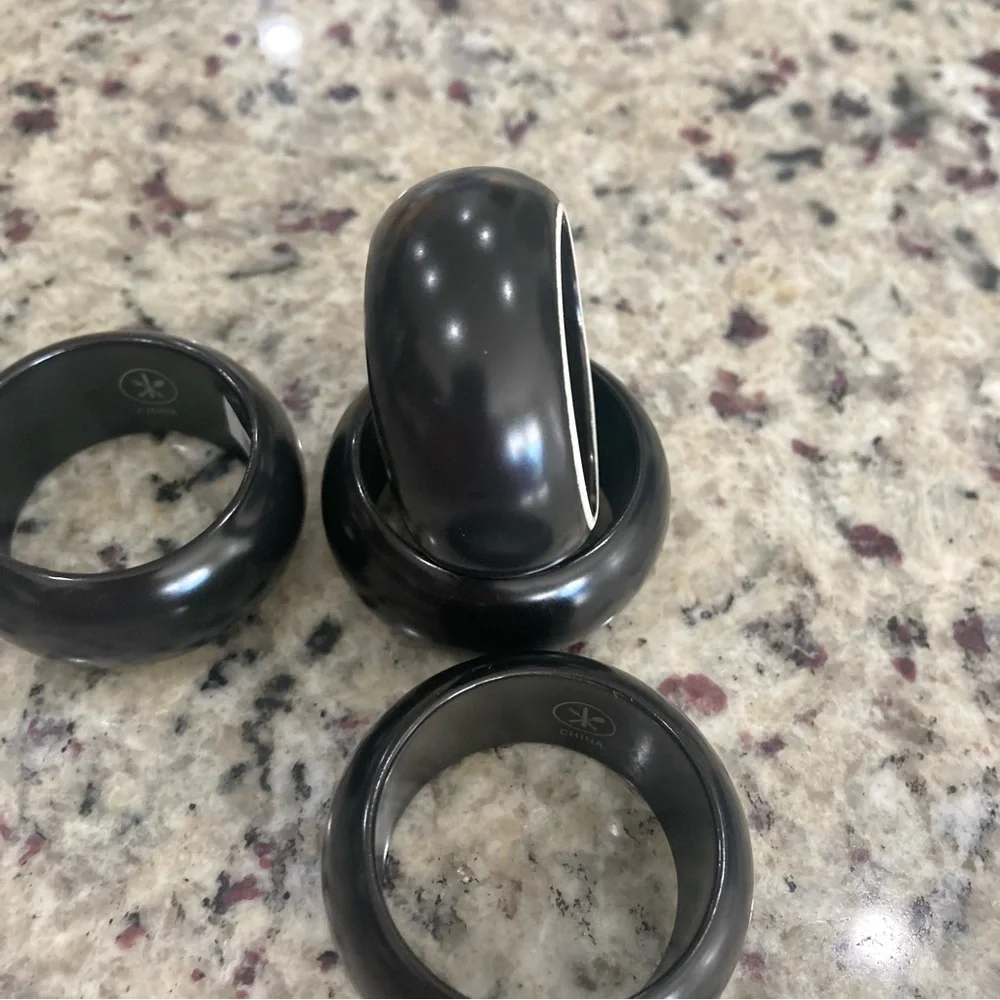 NWT Pier 1 Imports set of 4 black with white on one side ceramic napkin rings